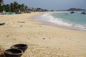 Nhon Hai Beach View with Typical Boats and Champa Ruins close to Quy Nhon at Chinese Sea | Vietnam