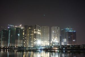 ...Saigon Skyline over Mekong River at Night...