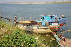 ...And Camped overnight at Mekong River with Rice Shipping 