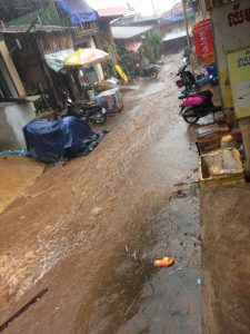 ...Old Town Centre and Main Road before her Shop and House in Mondulkiri | Cambodia