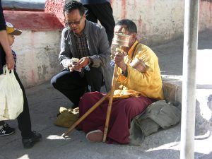 Monk at Work with Prayer Wheel at Drepang | China