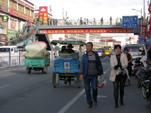 And Modern Crossing of Bejing Main Street in Lhasa | China