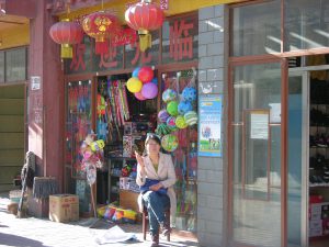 Easy Going Lady in Front of her Shop in Eastern Tibet | China